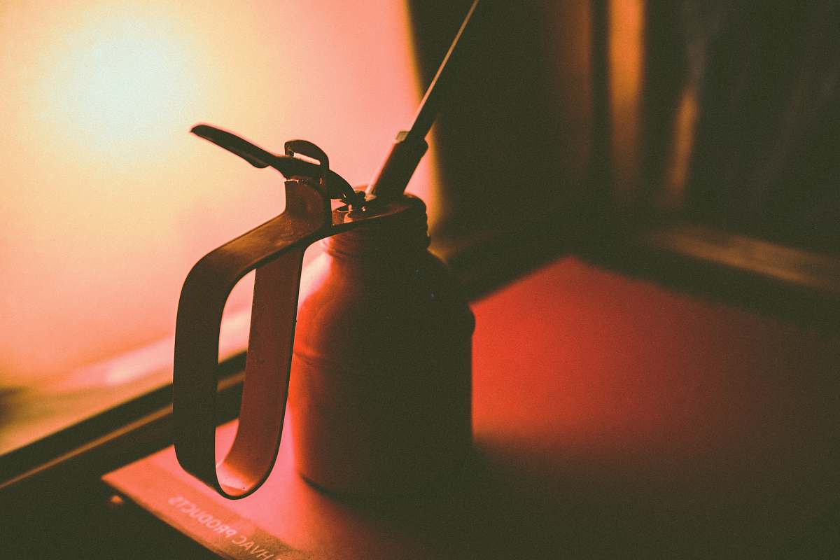 new delhi selective focus photography of oil can india